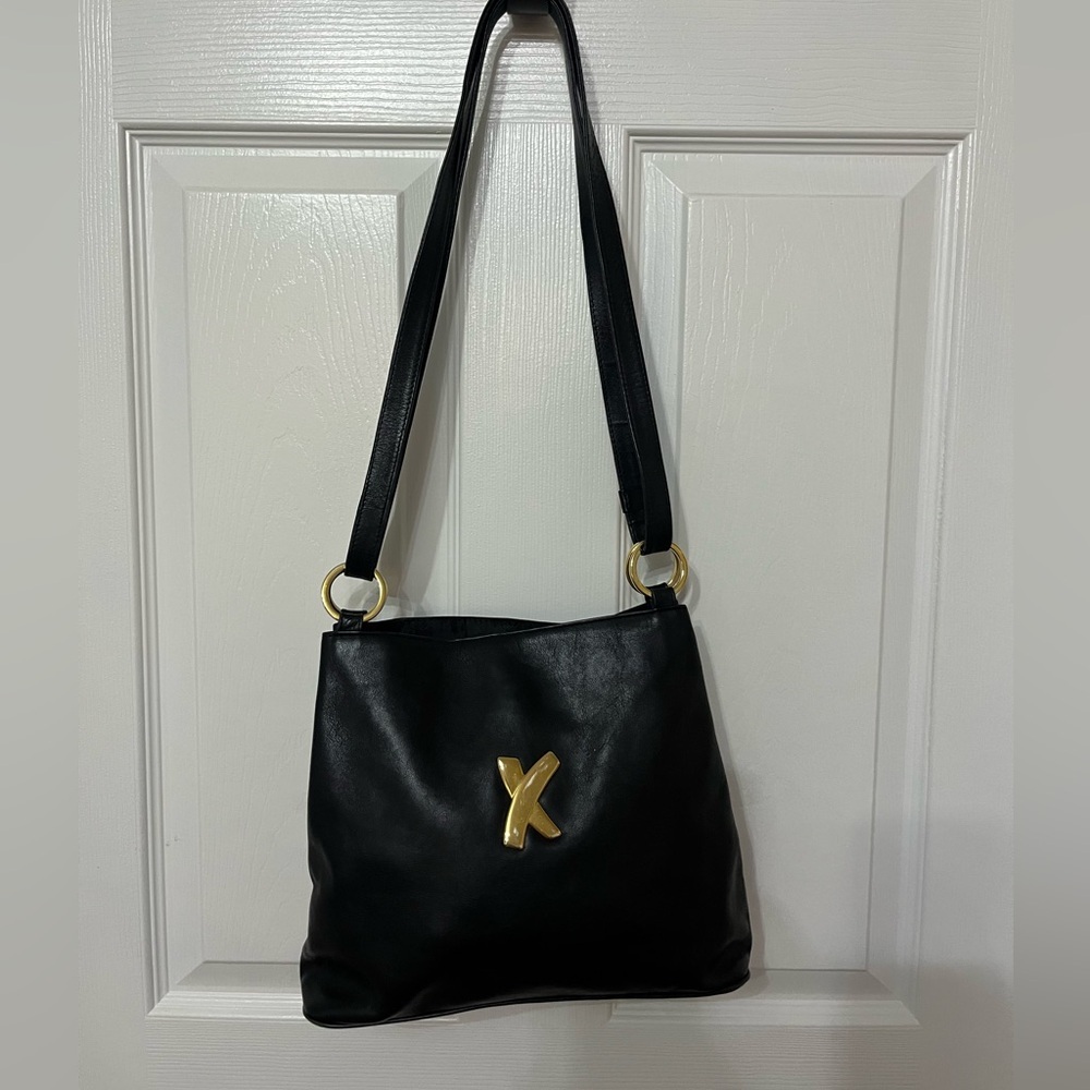 Paloma Picasso black leather shoulder bag with gold detail‎
